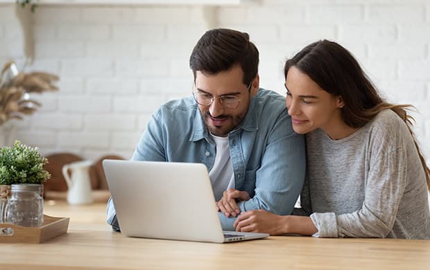 smiling-couple-using-laptop-at-home, digital, clean, web layout