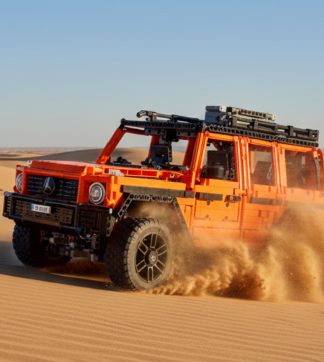 Red off-road vehicle model made of interlocking bricks on a white background