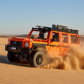 Red off-road vehicle model made of interlocking bricks on a white background