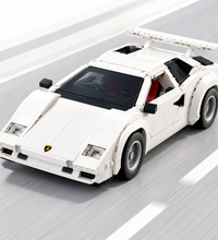 A white brick-built model of a Lamborghini Countach sports car, shown from a three-quarters front angle on a plain white background.
