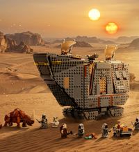 LEGO model of a desert vehicle with figures on a white background