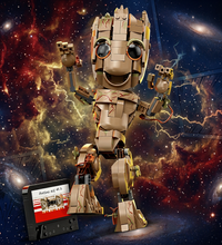 A toy-like humanoid robot character in tan, brown, and black stands on a white background, with a small cassette-style accessory labeled 'Avatar: The Last Airbender' placed in front.
