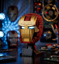 A Iron Man helmet model displayed on a black stand against a light gray background.